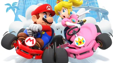 Mario and Princess Peach race in red and pink karts on a city course in Mario Kart Tour.