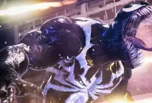 Venom lunges toward the viewer in a dark, illuminated action scene.