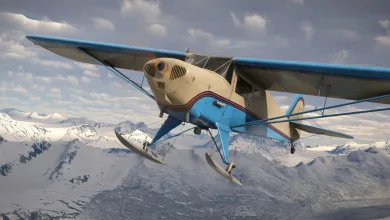 The Taylorcraft BC-12D ski-equipped aircraft flies over snow-covered mountains in Microsoft Flight Simulator 2024.