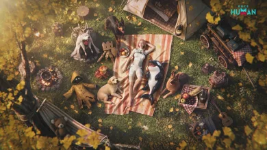 Overhead view of a Once Human character resting on a picnic blanket among several animals and outdoor supplies.