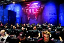 Crowd of attendees seated at computers beneath a Path of Exile 2 logo at the gamescom 2026 booth