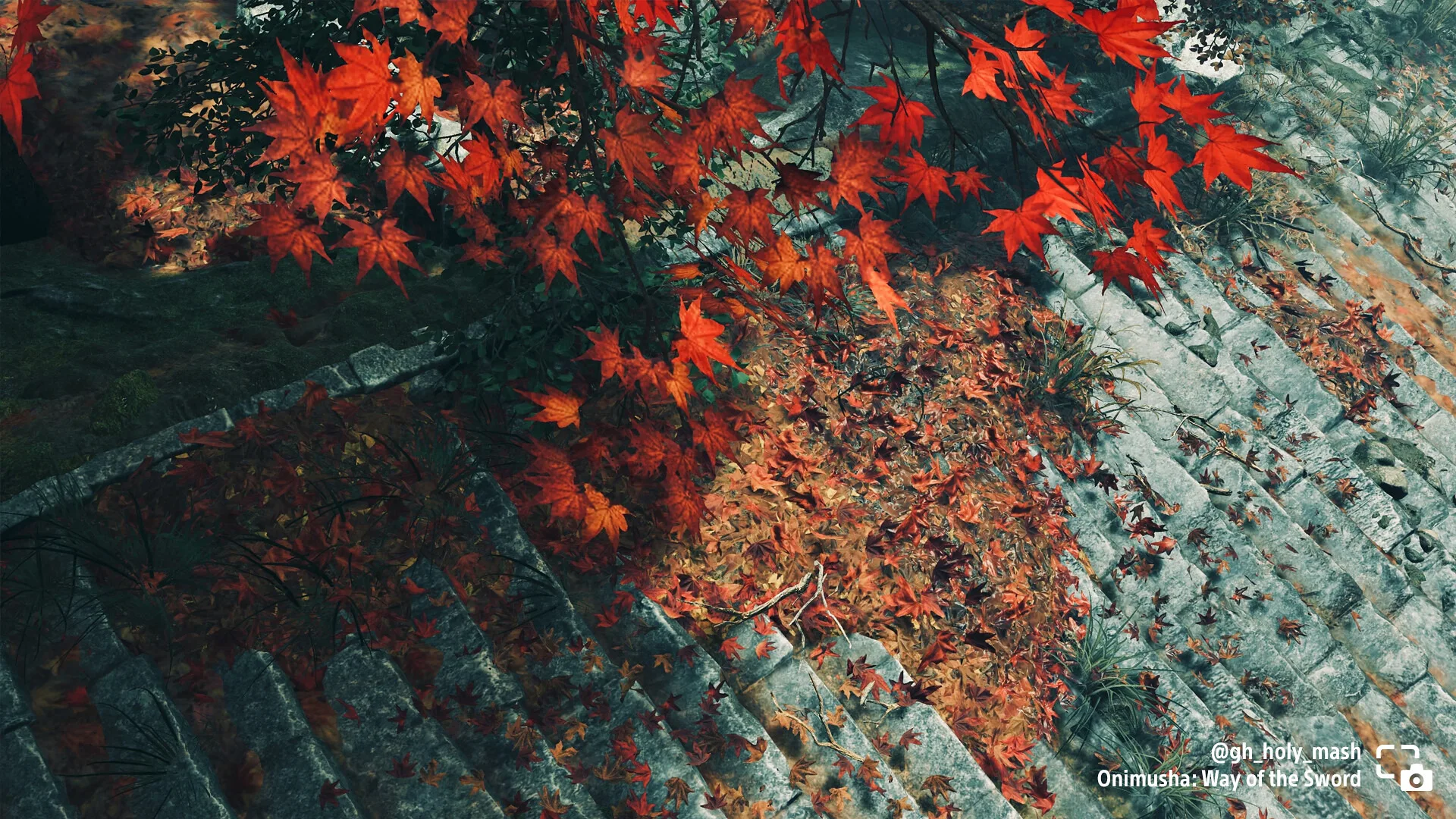 Red autumn leaves above stone and wooden structures in Onimusha: Way of the Sword
