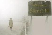 A lone figure walks through fog beneath a Welcome to Silent Hill sign