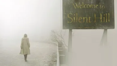 A lone figure walks through fog beneath a Welcome to Silent Hill sign