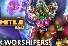 A jeweled SMITE 2 character with glowing purple eyes and a raised purple fist beside the 2X Worshipers event text.