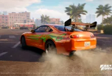 An orange sports car drifts through a city street in a Fast & Furious scene from Stuntman: Hollywood.