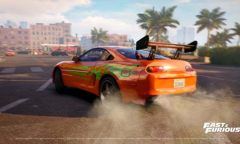 An orange sports car drifts through a city street in a Fast & Furious scene from Stuntman: Hollywood.