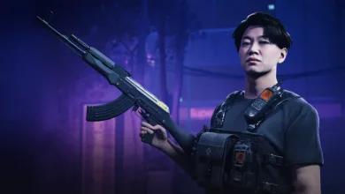 A THE FINALS contestant in dark tactical gear holds a rifle in a blue-lit interior.