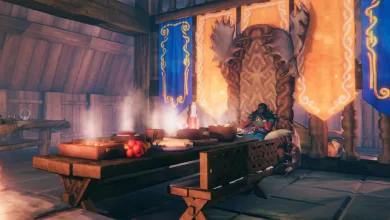 A Valheim banquet hall with long tables, food, blue and orange banners, and a seated character