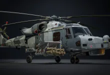 An AW159 Wildcat HMA2 helicopter displayed with multiple missiles mounted beneath its sides.