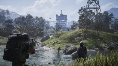 WARDOGS soldiers move through a river toward an industrial battlefield with hills and a tower in the background