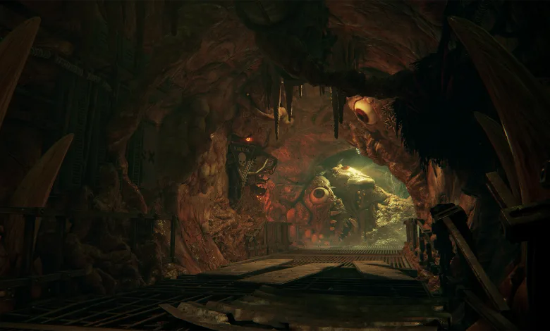 A fleshy, corrupted tunnel with an industrial walkway and bulbous growths in Warhammer 40,000: Darktide.