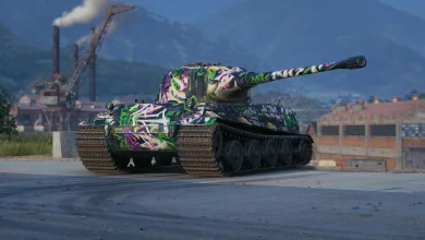 A brightly painted World of Tanks tank sits on a paved industrial area beneath mountains.