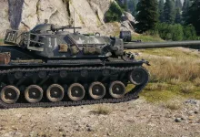 A World of Tanks tank drives through a forested mountain setting.