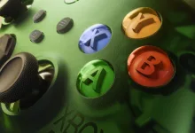 Close-up of the green Xbox X25 Wireless Controller special edition showing its colored face buttons and thumbsticks.