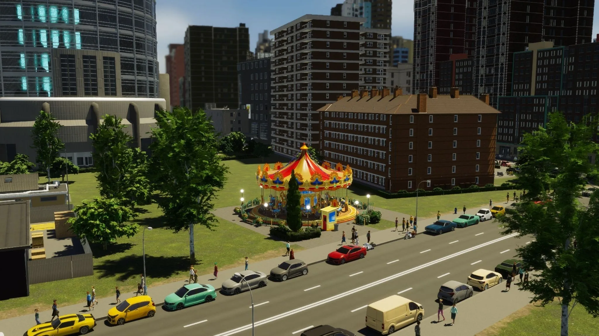 A carousel placed beside buildings and a city street