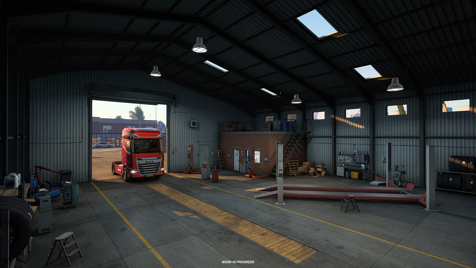 A red truck inside a garage workshop
