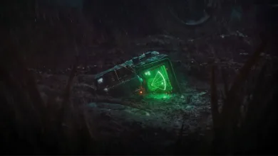 A glowing green motion tracker lies on the ground in a dark outdoor setting.