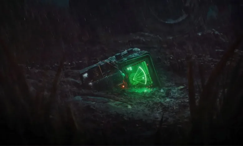 A glowing green motion tracker lies on the ground in a dark outdoor setting.
