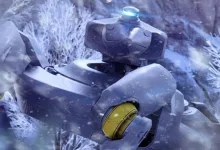 A large armored ARC machine with a glowing blue light stands among snow-covered branches.