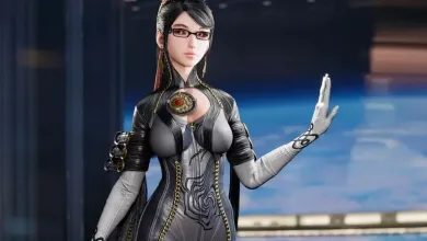 Bayonetta wears glasses and a black-and-silver outfit, raising one hand against a blue background.