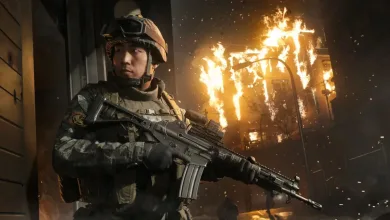A Modern Warfare 4 soldier holds a rifle in front of a burning city street.