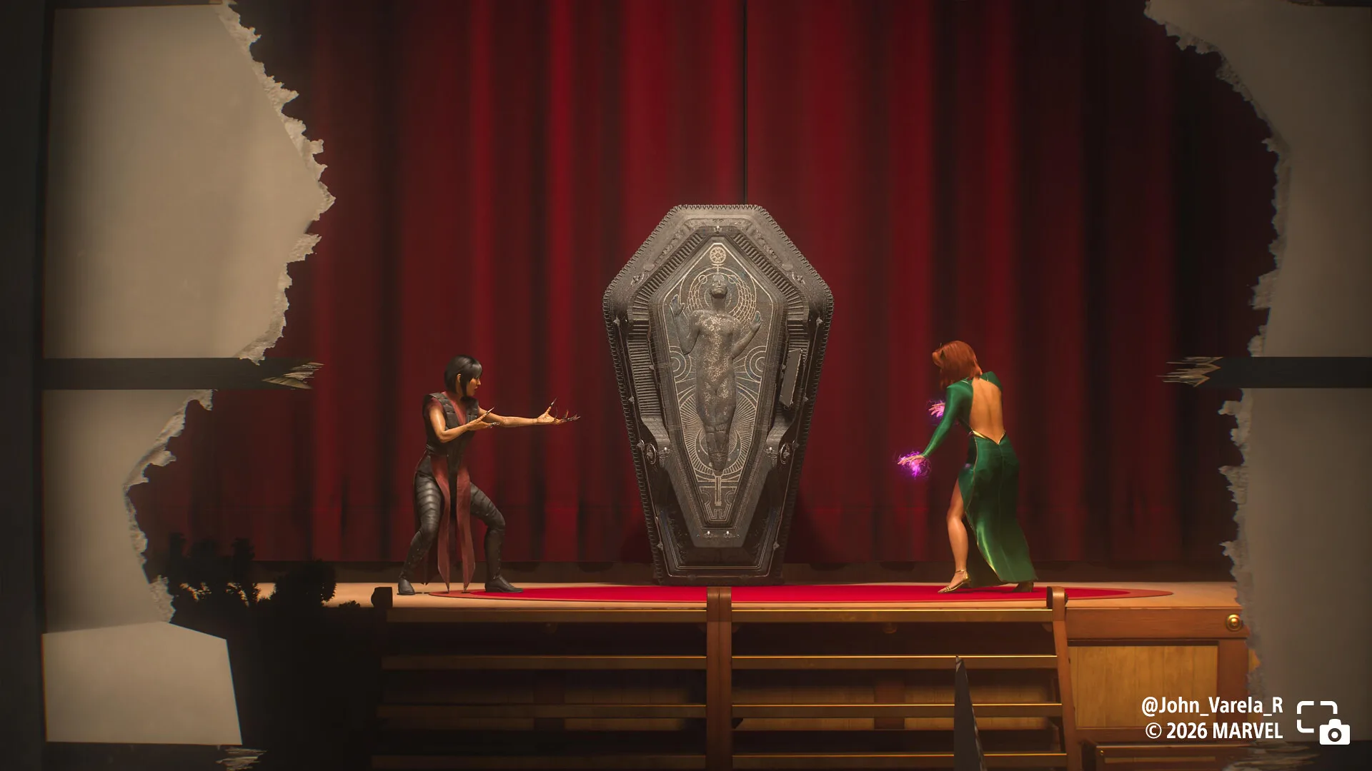 Deathstrike and Jean face off on a stage beside a coffin.