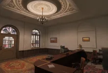 Interior room from Enlisted with a desk, chairs, framed pictures, and a chandelier
