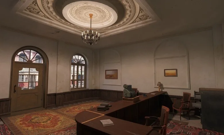 Interior room from Enlisted with a desk, chairs, framed pictures, and a chandelier