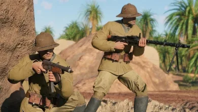 A standing soldier holds a machine gun while another crouches nearby in a desert scene from Enlisted.