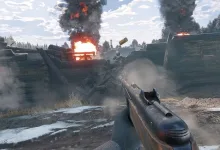 First-person view of a rifle aimed across a smoky Enlisted battlefield with fires burning in the distance.