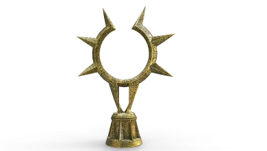 Ornate gold statue with a spiked ring mounted on a pedestal against a black background.