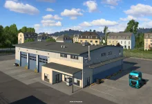 A wide truck garage with a turquoise truck parked outside in Euro Truck Simulator 2.