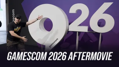 A man gestures toward an oversized 2026 display at Gamescom.