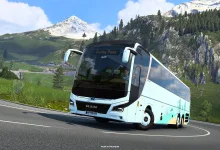 A white coach drives along a mountain road in Euro Truck Simulator 2.