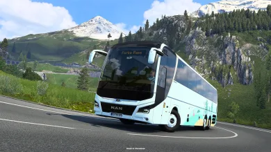 A white coach drives along a mountain road in Euro Truck Simulator 2.