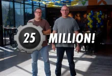 Two men stand beneath a large “25 MILLION!” graphic in a Fallout 76 announcement image.