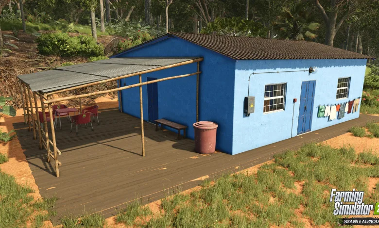 A blue farmhouse with a covered porch stands among the greenery in Farming Simulator 25.