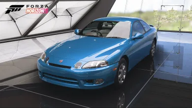A blue 1997 Toyota Soarer displayed inside a bright showroom in Forza Horizon 5.