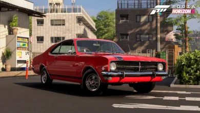 A red 1968 Holden Monaro parked on a Japanese city street in Forza Horizon 6.