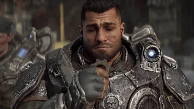 Close-up of an armored soldier with a glowing blue light on his shoulder.