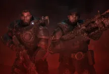 Two armored Gears of War: E-Day soldiers stand with rifles in a red smoky battle scene
