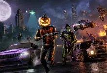 Pumpkin-headed and hooded characters stand among sports cars and motorcycles on a smoky Halloween night street beneath a full moon and city skyline.