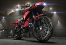 A red Pegassi Oppressor motorcycle with the Skulls livery displayed under indoor lights.