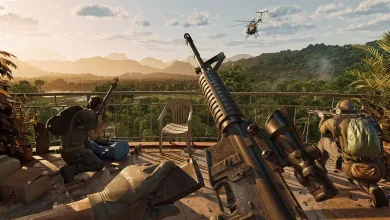 Two armed operators sit on a balcony with a rifle in the foreground as a helicopter passes overhead.