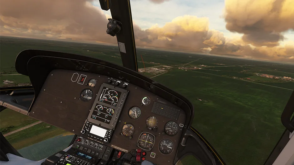 H125 cockpit above the landscape at dusk