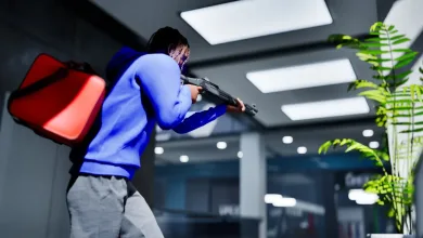 A character in a blue hoodie aims a shotgun inside a building in Hood Warfare 2.