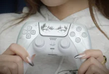 Lisa Limited Edition DualSense controller held in both hands