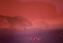 A suited explorer stands in a red, hazy landscape beside the wreckage of a crashed spacecraft.