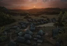 Aerial view of a medieval Manor Lords settlement and cultivated fields at sunset.